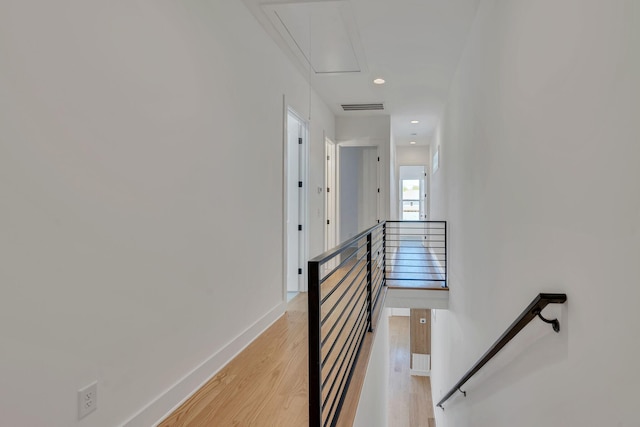 stairs featuring hardwood / wood-style flooring