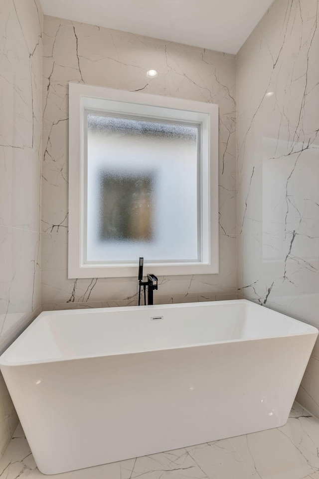 bathroom featuring a washtub