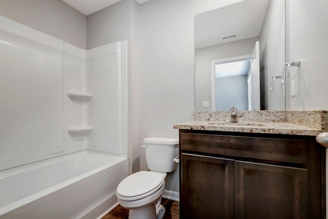 full bathroom with vanity, toilet, and washtub / shower combination