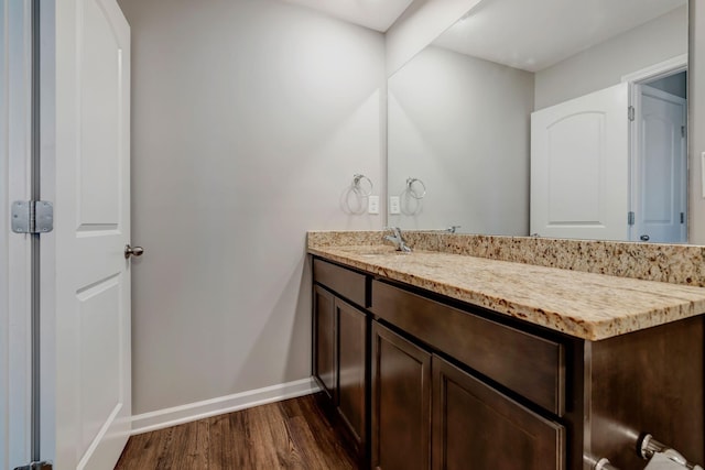 bathroom featuring vanity and hardwood / wood-style flooring