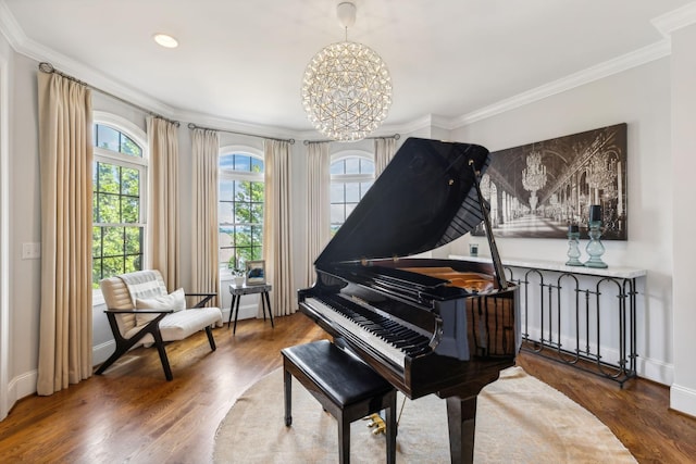 miscellaneous room featuring crown molding, dark hardwood / wood-style flooring, and an inviting chandelier