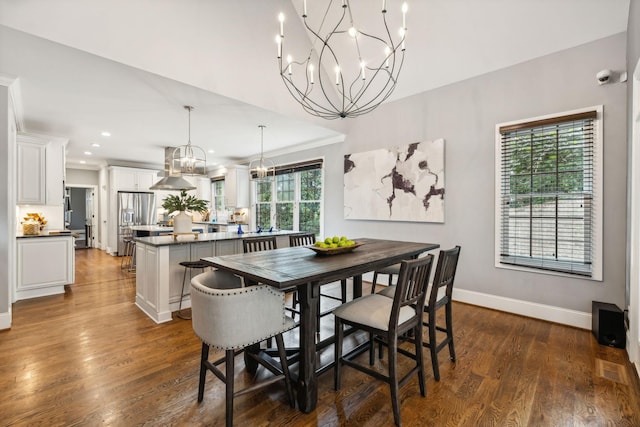 dining space with dark hardwood / wood-style floors