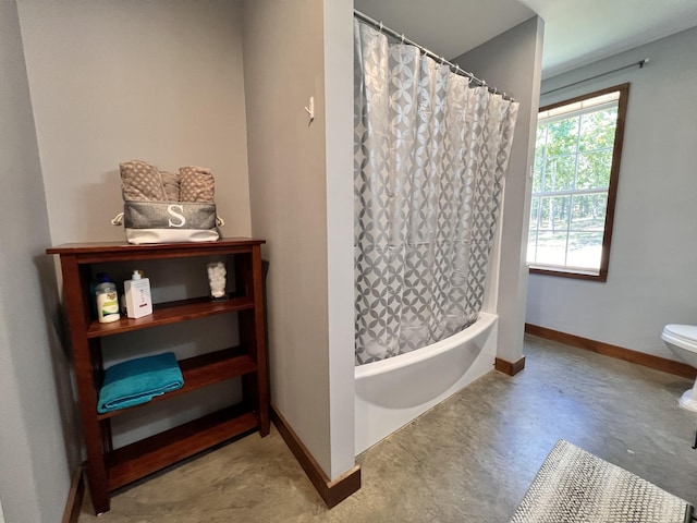 bathroom featuring toilet, shower / tub combo with curtain, and concrete floors