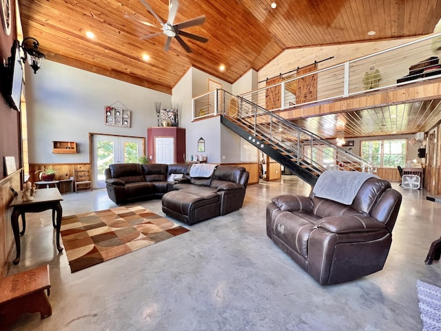 living room featuring concrete flooring, wooden ceiling, high vaulted ceiling, and french doors