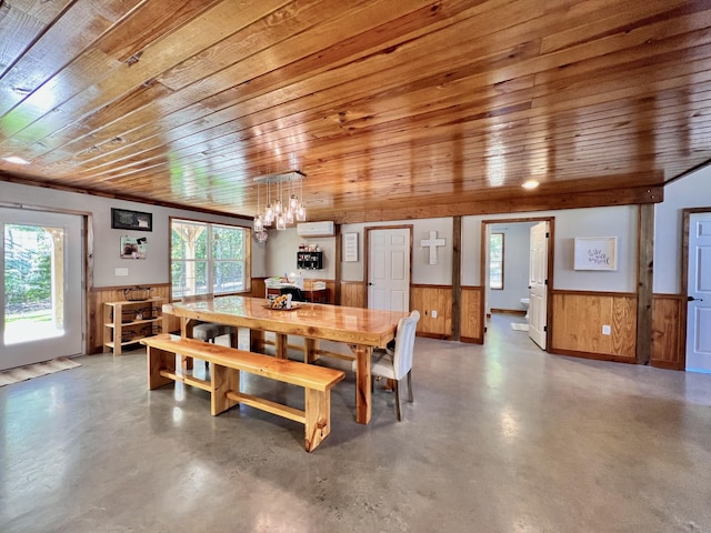 dining area with wooden walls, concrete flooring, a wall mounted AC, and wooden ceiling