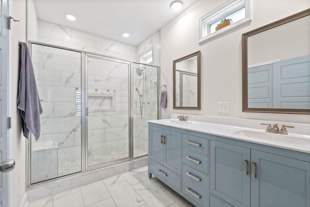 bathroom featuring vanity and a shower with door