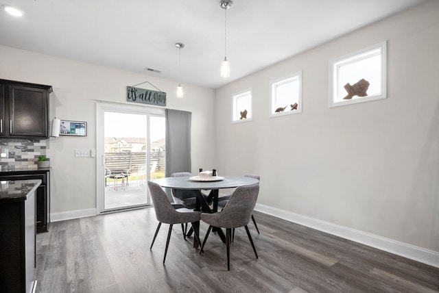 dining room with dark hardwood / wood-style flooring