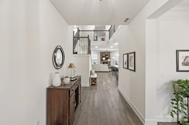 hallway with hardwood / wood-style floors