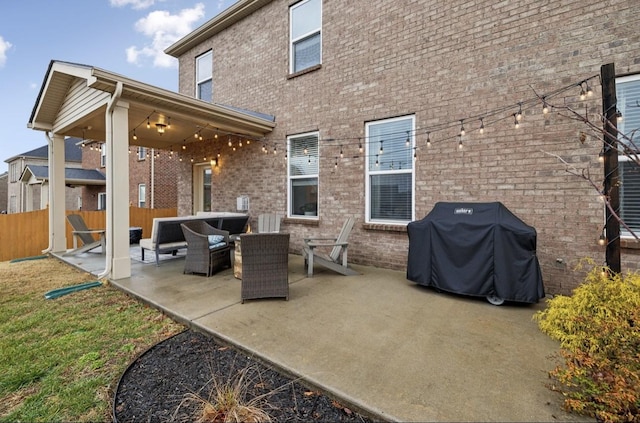 back of property with an outdoor hangout area and a patio area