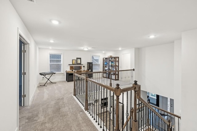 hallway with light carpet