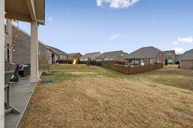 view of yard featuring a patio area and a playground