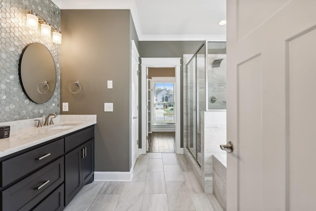 bathroom with crown molding, vanity, and an enclosed shower