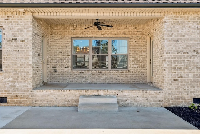 doorway to property featuring a patio and ceiling fan