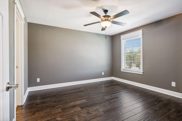 empty room featuring dark hardwood / wood-style floors and ceiling fan