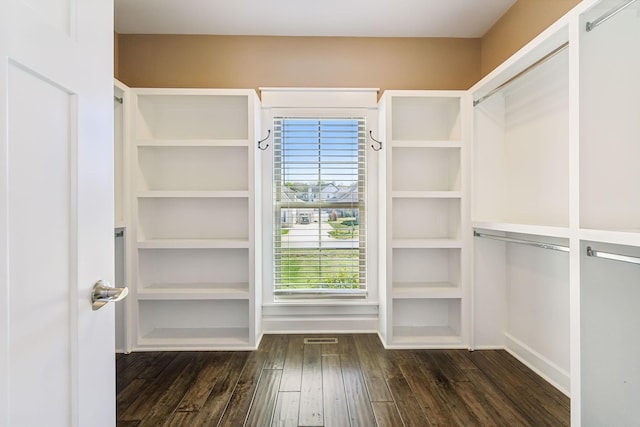 walk in closet featuring dark hardwood / wood-style floors