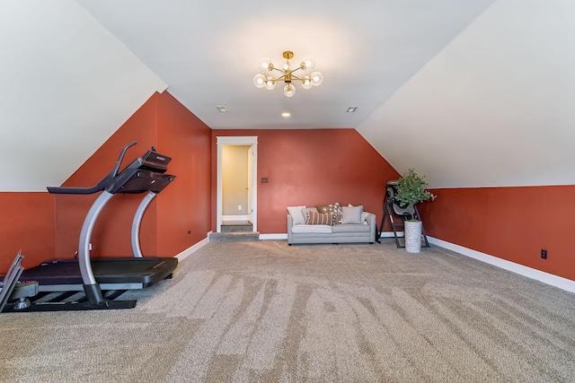 exercise room featuring lofted ceiling, carpet floors, and a notable chandelier