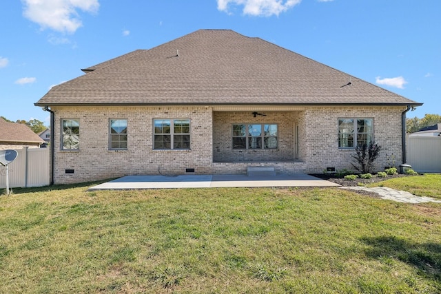 back of house featuring a yard and a patio area