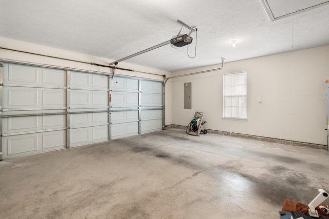 garage with a garage door opener and electric panel