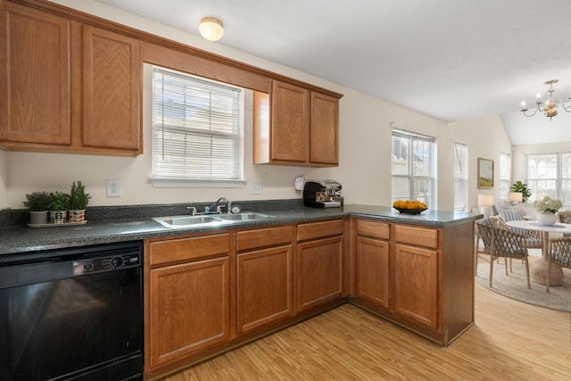 kitchen with lofted ceiling, sink, black dishwasher, kitchen peninsula, and light wood-type flooring