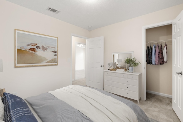 carpeted bedroom featuring a closet