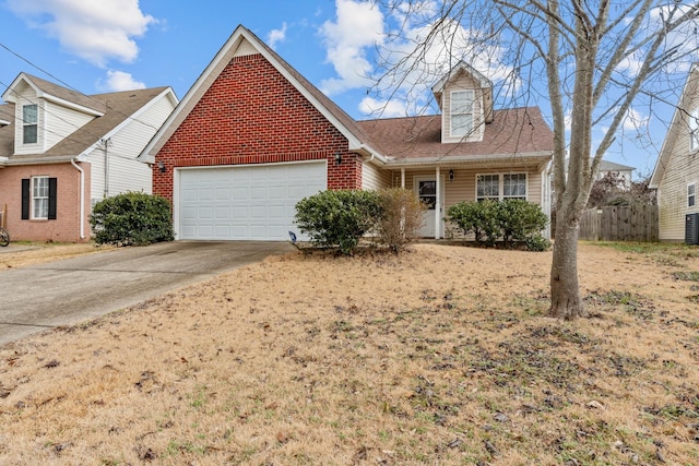 view of front of property featuring central AC and a garage