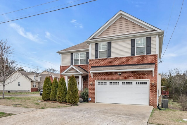 front of property with a garage and central air condition unit