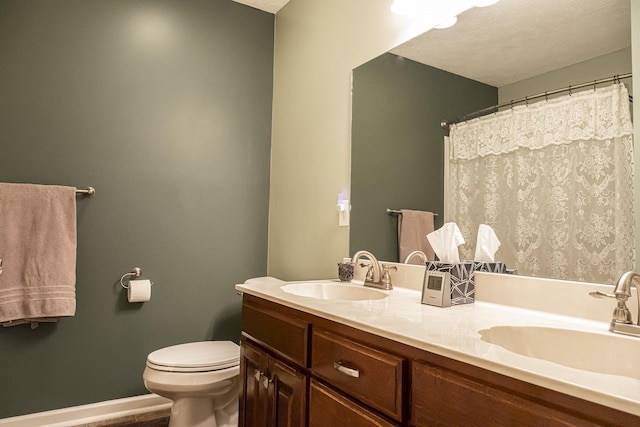 bathroom featuring vanity, a shower with curtain, and toilet