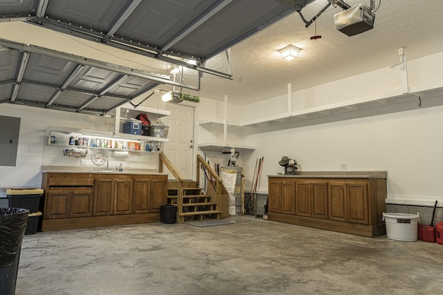 garage featuring a garage door opener and electric panel