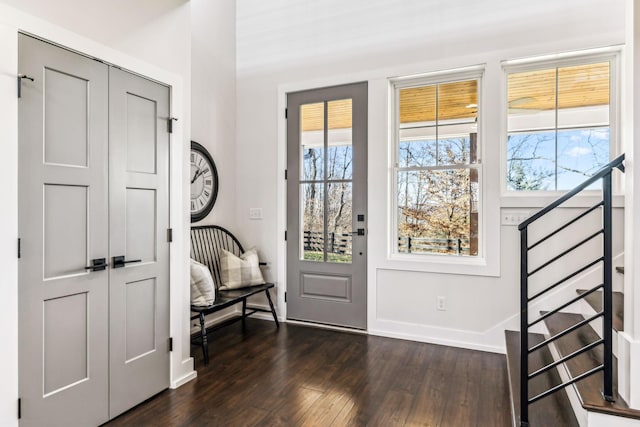 entryway with dark wood-type flooring