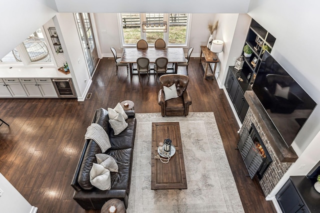 living room featuring wine cooler and dark hardwood / wood-style floors