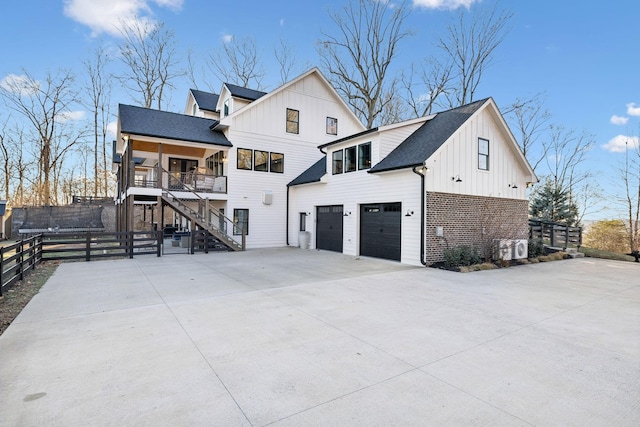 view of property exterior with a garage and a porch