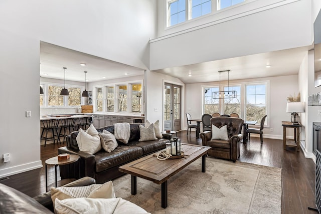 living room featuring hardwood / wood-style floors and a high ceiling