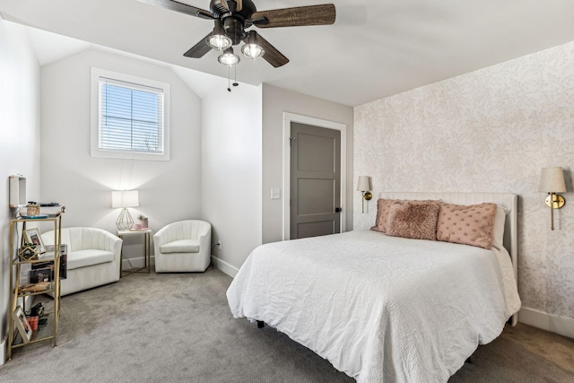 carpeted bedroom with vaulted ceiling and ceiling fan