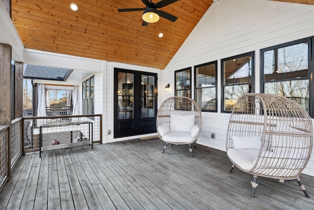 wooden terrace with ceiling fan and french doors