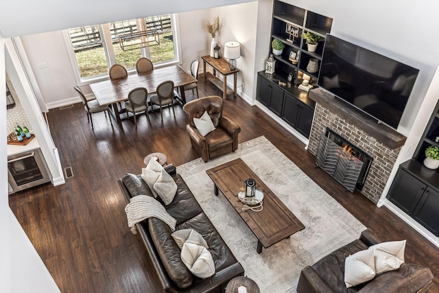 living room with wine cooler and dark hardwood / wood-style flooring