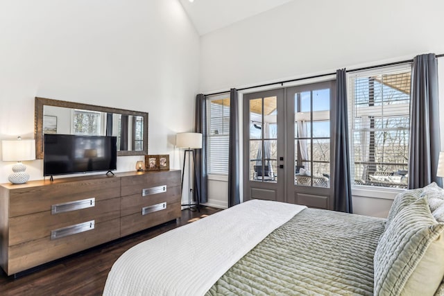 bedroom featuring french doors, dark hardwood / wood-style flooring, vaulted ceiling, and multiple windows