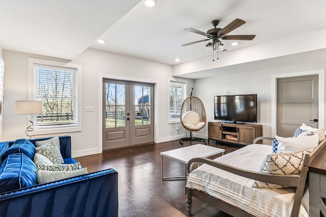 bedroom featuring french doors, ceiling fan, multiple windows, and access to outside