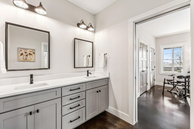 bathroom with vanity and concrete floors