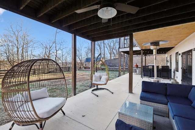 view of patio / terrace with ceiling fan and an outdoor living space