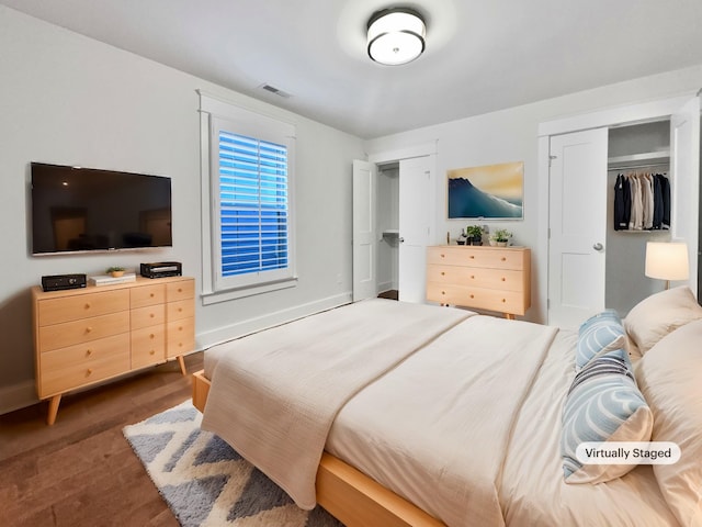 bedroom with multiple closets