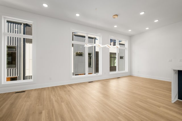 unfurnished living room featuring light hardwood / wood-style flooring