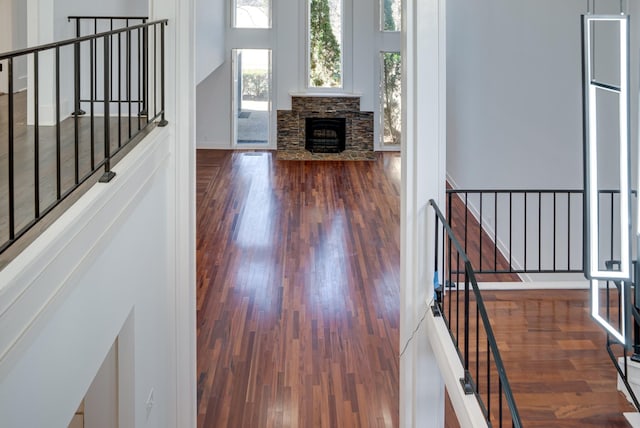 living room with a fireplace and dark hardwood / wood-style flooring