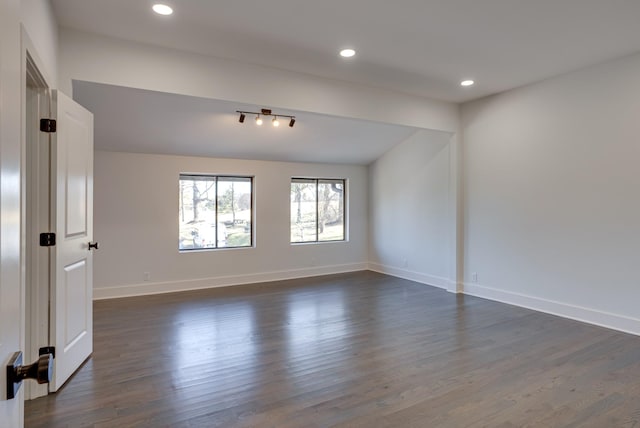 empty room featuring dark hardwood / wood-style flooring