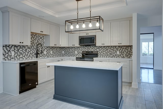 kitchen with stainless steel range with electric cooktop, white cabinetry, hanging light fixtures, a tray ceiling, and dishwasher