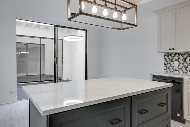 kitchen with gray cabinetry, black dishwasher, light stone countertops, and white cabinets