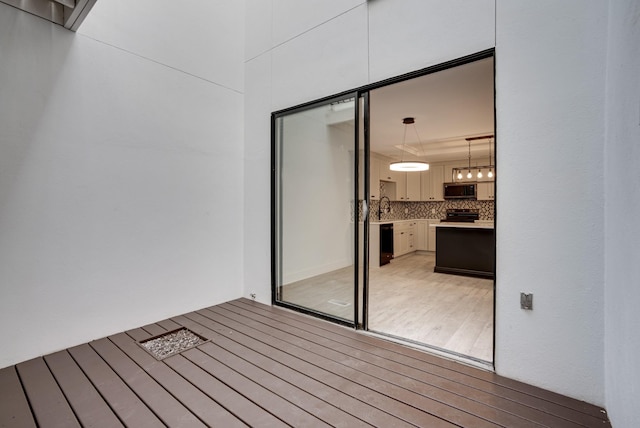 deck with sink and exterior kitchen