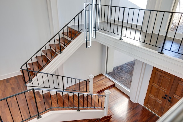 stairs with hardwood / wood-style flooring