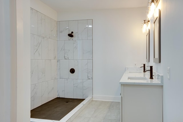 bathroom featuring vanity and tiled shower