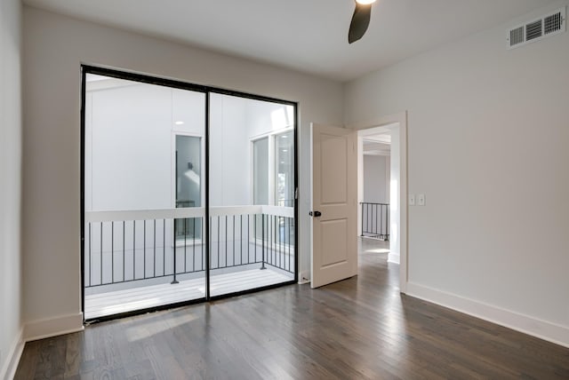 unfurnished room featuring dark hardwood / wood-style flooring and ceiling fan