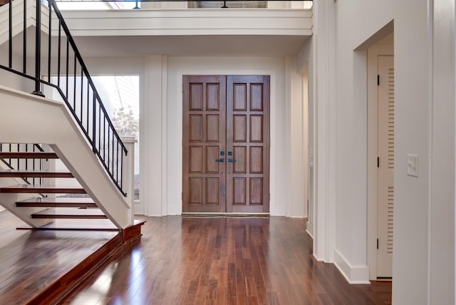 foyer entrance featuring dark hardwood / wood-style flooring